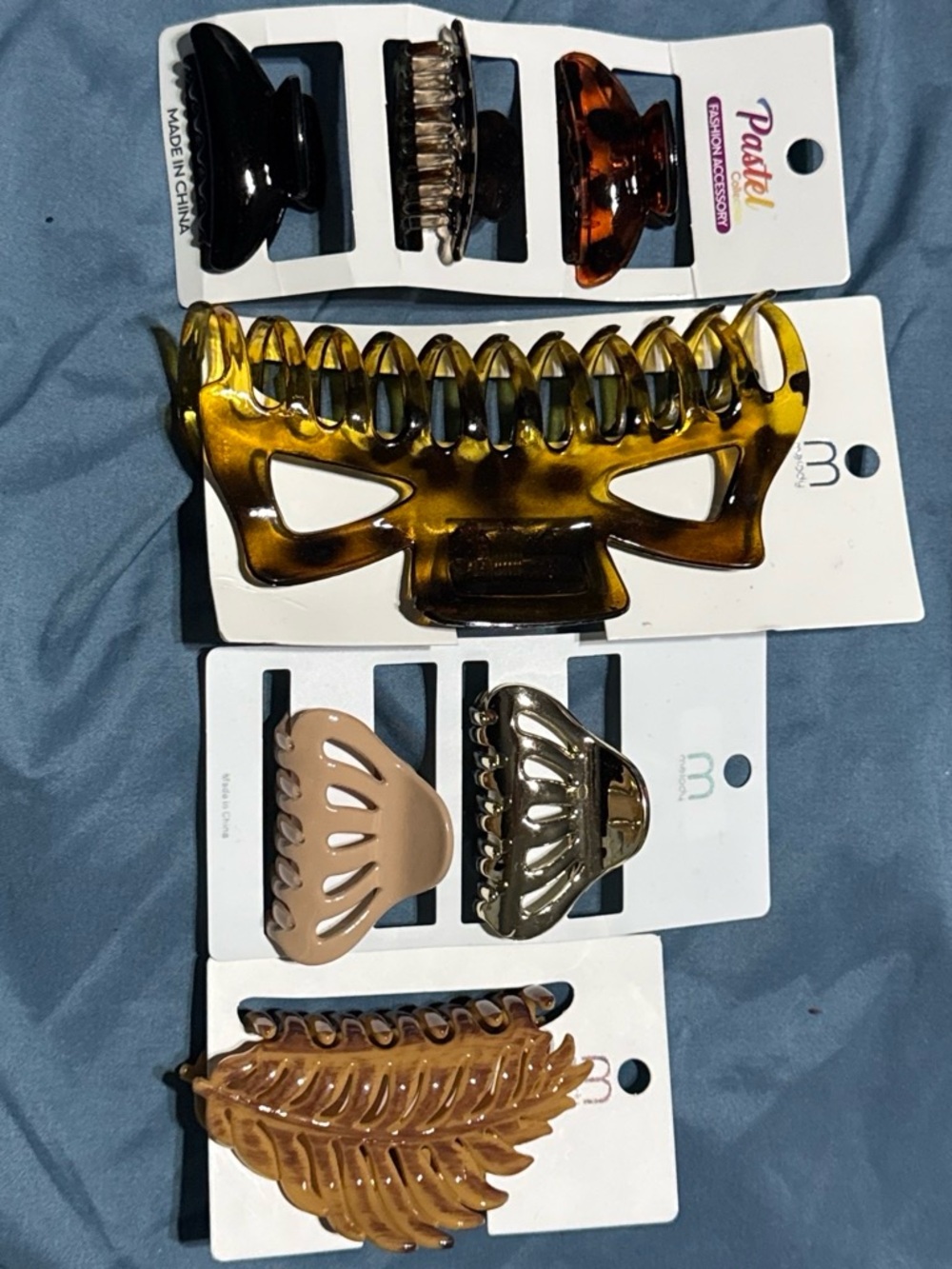 Assortment of Multi-colored hair claw clips.